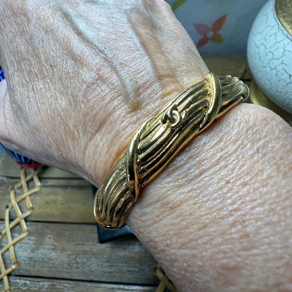 CHANEL vintage gold plated twisted CC bangle